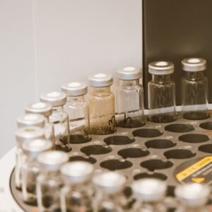 Glass vials arranged in a laboratory rack