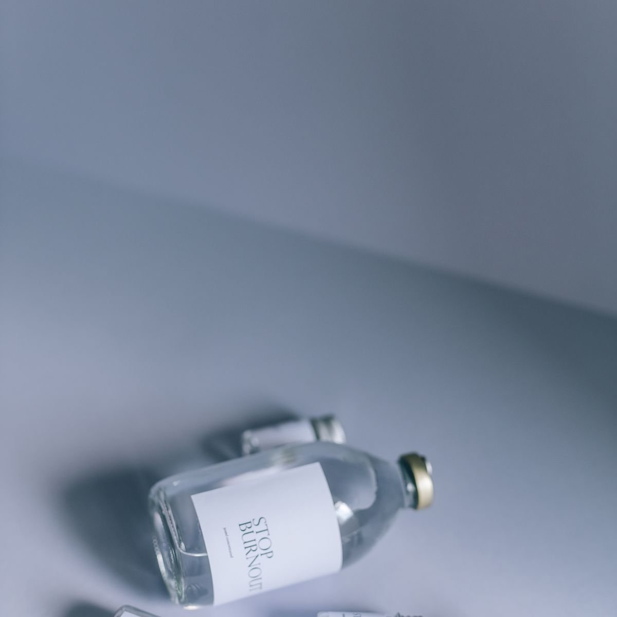 Glass research vials on a neutral studio background